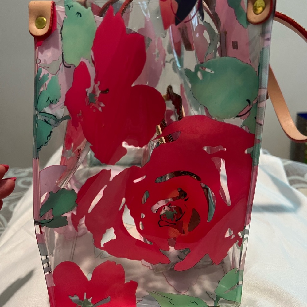 Dooney and Bourke clear/Rose Garden tote with matching make up bag